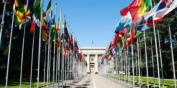 The Allée des Nations, with the flags of the member countries at the the United Nations Office at Geneva, Switzerland.